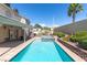 A stunning pool with spa is perfect for outdoor relaxation, paired with a covered patio and lush landscaping at 1502 Oxbow Ct, Henderson, NV 89014