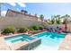 Inviting backyard pool and spa for relaxation and outdoor entertainment, perfect for summer days at 1502 Oxbow Ct, Henderson, NV 89014