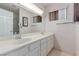 Bathroom featuring a double sink vanity and a shower at 1513 Brocado Ln, Las Vegas, NV 89117