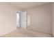 Neutral bedroom with view into adjacent room at 1513 Brocado Ln, Las Vegas, NV 89117