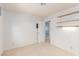 Cozy bedroom features neutral carpet, shelves, and ample natural light at 1513 Brocado Ln, Las Vegas, NV 89117