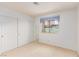 Bright bedroom features a window and a closet with double doors at 1513 Brocado Ln, Las Vegas, NV 89117
