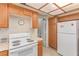 Cozy kitchen with white stove and refrigerator at 1513 Brocado Ln, Las Vegas, NV 89117