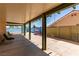 The covered patio overlooks a pool and has nice backyard views at 1513 Brocado Ln, Las Vegas, NV 89117