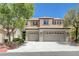 Well-maintained two-story home with a three-car garage and tile roof at 1624 Ravanusa Dr, Henderson, NV 89052
