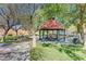 Community park gazebo with picnic tables and mature trees at 1624 Ravanusa Dr, Henderson, NV 89052