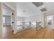 Hallway with wood floors, black iron railing, and natural light from windows at 1624 Ravanusa Dr, Henderson, NV 89052
