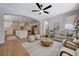 Open concept living room view into kitchen with island and stainless appliances at 1624 Ravanusa Dr, Henderson, NV 89052