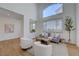 Bright living room with comfortable seating, large windows, and a modern design at 1624 Ravanusa Dr, Henderson, NV 89052