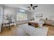 Bright main bedroom with neutral decor, accent rug, and vaulted ceilings at 1624 Ravanusa Dr, Henderson, NV 89052