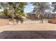 Spacious backyard featuring a dirt ground and block wall providing a blank canvas for outdoor customization at 165 Spinnaker Dr, Henderson, NV 89015
