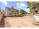 Spacious backyard offers a blank canvas for landscaping or outdoor living, complete with a covered patio at 165 Spinnaker Dr, Henderson, NV 89015