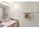 Neat bathroom featuring a sink, vanity and a large mirror at 165 Spinnaker Dr, Henderson, NV 89015