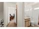 Bathroom near a study room, featuring a bathtub and sink at 165 Spinnaker Dr, Henderson, NV 89015