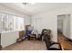 Bedroom features neutral carpet, a window, sliding door closet and access to hallway at 165 Spinnaker Dr, Henderson, NV 89015
