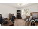 Bedroom features neutral carpet, a window, and multiple pieces of wooden furniture at 165 Spinnaker Dr, Henderson, NV 89015