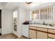 Functional kitchen featuring essential appliances and an easy access to the backyard at 165 Spinnaker Dr, Henderson, NV 89015
