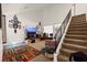 Bright living room featuring high ceilings, staircase and carpeted floors, ideal for comfortable living at 165 Spinnaker Dr, Henderson, NV 89015