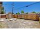 Spacious backyard featuring a wood fence, utility shed, and ample room for recreation at 1708 Cedar Ave, Las Vegas, NV 89101