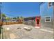 Backyard view of home, black building, and shed at 1708 Cedar Ave, Las Vegas, NV 89101