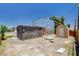 Rear view of home, with shed and black building. Spacious backyard with storage shed at 1708 Cedar Ave, Las Vegas, NV 89101