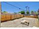 Large backyard with wooden fence offering plenty of privacy and space for outdoor activities at 1708 Cedar Ave, Las Vegas, NV 89101