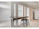 A view of bar with seating area and adjacent kitchen for entertaining at 1708 Cedar Ave, Las Vegas, NV 89101