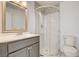 Bathroom with gray vanity, round-glass enclosed shower, and modern fixtures at 1708 Cedar Ave, Las Vegas, NV 89101