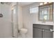 Clean, updated bathroom featuring a glass shower stall, toilet, and vanity with a framed mirror at 1708 Cedar Ave, Las Vegas, NV 89101