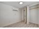 Bright bedroom with a modern split-unit A/C, closet, vinyl floors and an open doorway at 1708 Cedar Ave, Las Vegas, NV 89101