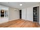 Bedroom with hardwood floors and closet with built in shelves and kitchen access at 1708 Cedar Ave, Las Vegas, NV 89101