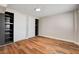 Bedroom with hardwood floors and closet with built in shelves for optimal storage at 1708 Cedar Ave, Las Vegas, NV 89101