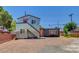 Unique modern two-story home with corrugated metal siding and contrasting orange doors at 1708 Cedar Ave, Las Vegas, NV 89101