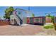 Contemporary exterior with a corrugated metal facade and brightly colored orange doors at 1708 Cedar Ave, Las Vegas, NV 89101