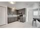 Updated kitchen boasts grey cabinetry, stainless appliances, and tile backsplash at 1708 Cedar Ave, Las Vegas, NV 89101
