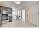 Bright open kitchen layout showcasing stainless appliances, gray cabinets, and eating area at 1708 Cedar Ave, Las Vegas, NV 89101