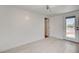 Open living area features light wood-look floors and access to backyard at 1708 Cedar Ave, Las Vegas, NV 89101
