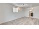 Bright living room with wood-look floors, AC, and easy access to bathroom and bedroom at 1708 Cedar Ave, Las Vegas, NV 89101