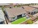Aerial view showcasing a home with well-kept backyard with turf and patio in a residential area at 172 Lunga Ave, Henderson, NV 89011