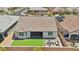 Aerial view of a well-manicured backyard with artificial turf and patio, surrounded by neighboring homes at 172 Lunga Ave, Henderson, NV 89011