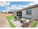 Backyard with artificial turf, patio, and seating, providing a low-maintenance outdoor space at 172 Lunga Ave, Henderson, NV 89011