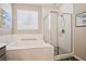 Relaxing bathroom with soaker tub and glass enclosed walk-in shower at 172 Lunga Ave, Henderson, NV 89011