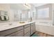 Serene primary bath with dual sinks, soaker tub and separate shower at 172 Lunga Ave, Henderson, NV 89011