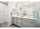 Modern primary bathroom with double vanity and soft, natural lighting at 172 Lunga Ave, Henderson, NV 89011