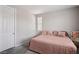 Cozy bedroom features plush carpet, bed with pillows, and natural light at 172 Lunga Ave, Henderson, NV 89011
