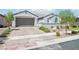 Charming single-story home featuring a well-kept front yard with block wall and lush green shrubs at 172 Lunga Ave, Henderson, NV 89011
