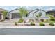Charming single-story home showcasing a well-kept front yard and a two-car garage at 172 Lunga Ave, Henderson, NV 89011