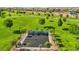 Community game court surrounded by green space, trees, and manicured landscaping at 172 Lunga Ave, Henderson, NV 89011