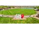 Community green space with sign stating, 'It all starts here' and lush landscaping at 172 Lunga Ave, Henderson, NV 89011