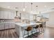 Contemporary kitchen with a large island, seating, stainless steel appliances, and pendant lighting at 172 Lunga Ave, Henderson, NV 89011